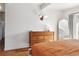 Bright bedroom features a mid-century modern dresser and ample natural light at 1486 S Elm St, Denver, CO 80222