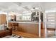 Bright kitchen with island, stainless steel appliances, and stylish backsplash, creating a functional and attractive space at 1486 S Elm St, Denver, CO 80222