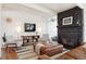 Bright living room featuring a sleek fireplace, modern furnishings, and stylish decor at 1486 S Elm St, Denver, CO 80222