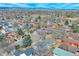 Aerial view of a residential neighborhood with mature trees and mountain views at 1834 Hennington Ct, Longmont, CO 80501