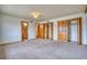 Bedroom with carpet, closets, and natural light at 1834 Hennington Ct, Longmont, CO 80501