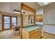 Inviting dining area featuring hardwood floors and a wood beam ceiling, perfect for Gathering meals at 1834 Hennington Ct, Longmont, CO 80501
