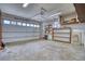 Spacious two car garage with ample storage space and shelving, offering a practical area for vehicles and organization at 1834 Hennington Ct, Longmont, CO 80501