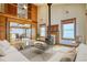Bright living room featuring hardwood floors, wood burning fireplace, and a second story loft at 1834 Hennington Ct, Longmont, CO 80501