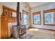 Charming living room with a wood-burning stove and hardwood floors at 1834 Hennington Ct, Longmont, CO 80501