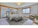 Cozy primary bedroom with neutral tones, plush carpet, and natural light at 1834 Hennington Ct, Longmont, CO 80501