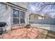 Cozy patio space with brick flooring, perfect for outdoor entertaining and relaxation at 1834 Hennington Ct, Longmont, CO 80501