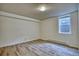 A bright room featuring wood floors and a window at 1834 Hennington Ct, Longmont, CO 80501