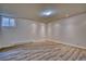 A bright room featuring wood floors and ample natural light at 1834 Hennington Ct, Longmont, CO 80501