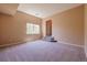 Bedroom featuring carpet floors, an arched entryway and bright natural light at 10085 Charissglen Ct, Highlands Ranch, CO 80126