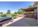 Expansive deck with hot tub, lush landscaping and outdoor living space at 10085 Charissglen Ct, Highlands Ranch, CO 80126