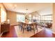Open dining area with hardwood floors and view of downstairs living room at 10085 Charissglen Ct, Highlands Ranch, CO 80126