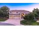 Beautiful two-story home featuring a three-car garage and mature landscaping at 10085 Charissglen Ct, Highlands Ranch, CO 80126