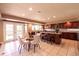Spacious kitchen with a dining table featuring modern appliances and ample countertop space at 10085 Charissglen Ct, Highlands Ranch, CO 80126