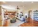 Open-concept living room with comfortable seating and a view of the kitchen at 10085 Charissglen Ct, Highlands Ranch, CO 80126