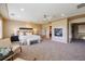 Elegant main bedroom features fireplace, ceiling fan, and a seating area, creating a relaxing retreat at 10085 Charissglen Ct, Highlands Ranch, CO 80126