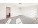 Spacious bedroom with grey carpet, white walls, ceiling light, with an ensuite bathroom at 13382 E 110Th Way, Commerce City, CO 80022
