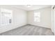 Cozy bedroom with two windows that bring in natural light and grey carpet at 13382 E 110Th Way, Commerce City, CO 80022