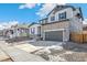 Charming two-story home with a two-car garage, stone accents, and a well-maintained front yard at 13382 E 110Th Way, Commerce City, CO 80022