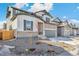Charming two-story home with stone accents, a two-car garage, and manicured landscaping at 13382 E 110Th Way, Commerce City, CO 80022