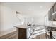 Open-concept kitchen and living space filled with natural light and features modern appliances and wood floors at 13382 E 110Th Way, Commerce City, CO 80022