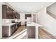 Contemporary kitchen with stainless steel appliances, quartz countertops, island, and ample cabinet space at 13382 E 110Th Way, Commerce City, CO 80022