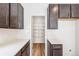 This kitchen has a large pantry, quartz countertops and stainless steel appliances at 13382 E 110Th Way, Commerce City, CO 80022