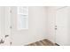 Mud room features doors leading outside and to a closet, with wood floors and white walls at 13382 E 110Th Way, Commerce City, CO 80022