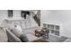 Finished basement features a cozy sitting area, wet bar, and ample storage at 6003 Chester Way, Denver, CO 80238