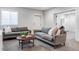 Spacious basement recreation area with two sofas and a coffee table at 6003 Chester Way, Denver, CO 80238