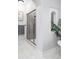Clean bathroom with a glass shower and tiled walls at 6003 Chester Way, Denver, CO 80238