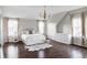 Bright bedroom with hardwood floors and a queen-size bed at 6003 Chester Way, Denver, CO 80238