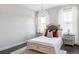 Serene bedroom with a queen-size bed and antique-style wooden headboard at 6003 Chester Way, Denver, CO 80238