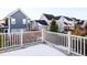 Private deck with white railing offering views of the neighborhood at 6003 Chester Way, Denver, CO 80238