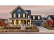 Stunning two-story home with a charming front porch and landscaped yard at 6003 Chester Way, Denver, CO 80238