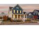Charming two-story home with a welcoming front porch at 6003 Chester Way, Denver, CO 80238