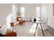 Bright home office features hardwood floors, a built-in desk, and ample natural light at 6003 Chester Way, Denver, CO 80238