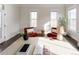Sunlit home office with two comfortable armchairs and a large work surface at 6003 Chester Way, Denver, CO 80238
