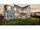 Two-story house exterior with a large deck and backyard at 6003 Chester Way, Denver, CO 80238