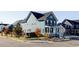 Two-story house with front porch, landscaping and driveway at 6003 Chester Way, Denver, CO 80238