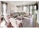 Bright living room featuring a spacious sectional sofa and a cozy fireplace at 6003 Chester Way, Denver, CO 80238