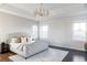 Spacious main bedroom with a king-size bed and plenty of natural light at 6003 Chester Way, Denver, CO 80238