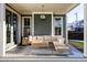 Relaxing patio with sectional sofa and coffee table, perfect for outdoor entertaining at 6003 Chester Way, Denver, CO 80238