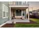 Covered patio with comfortable seating area at 6003 Chester Way, Denver, CO 80238