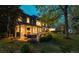 Expansive backyard featuring a patio, well-manicured lawn, and mature trees, creating a private and peaceful retreat at 1512 Cottonwood Ln, Greenwood Village, CO 80121