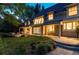 Spacious backyard with patio, mature trees, and lush lawn, offering a private and serene outdoor space at 1512 Cottonwood Ln, Greenwood Village, CO 80121