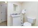 Clean and modern bathroom with a single sink vanity, toilet, and towel rack at 1512 Cottonwood Ln, Greenwood Village, CO 80121