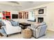 Cozy living room with built-in shelving, a fireplace, and a window seat for reading at 1512 Cottonwood Ln, Greenwood Village, CO 80121