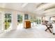 Bright living room with backyard views, French doors and natural light at 1512 Cottonwood Ln, Greenwood Village, CO 80121