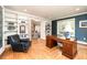 Bright home office featuring built-in bookshelves and a classic wooden desk at 1512 Cottonwood Ln, Greenwood Village, CO 80121